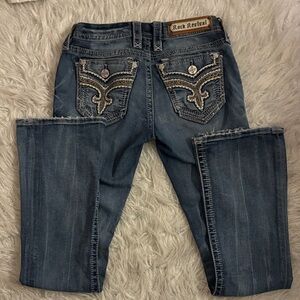 Rock Revival Women's Boot Cut Jeans in Blue with Embellished Pockets